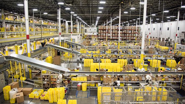 the inside of an amazon fulfillment center with conveyor belts